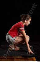  Ruby  1 dressed flip flop jeans shorts kneeling red t shirt whole body 0007.jpg